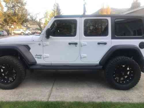 white lifted jeep